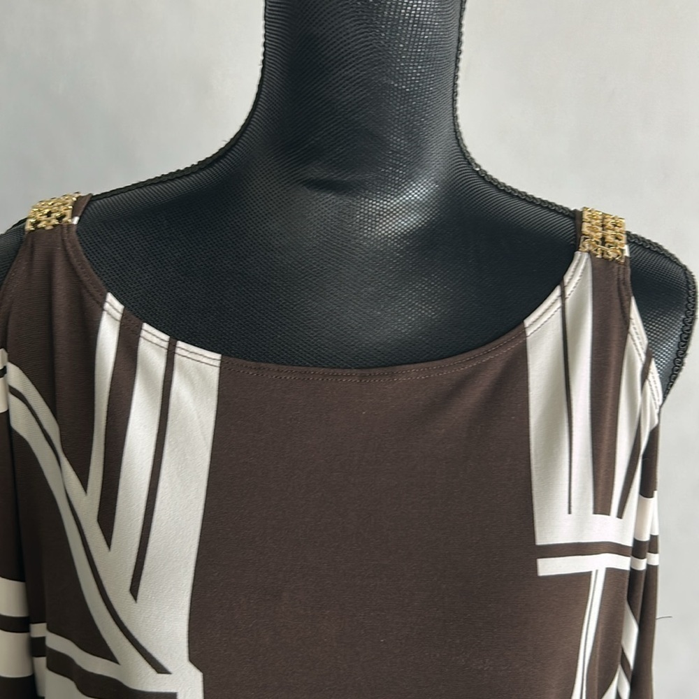 Chico’s cold shoulder tunic. Brown /white. Gold accents. Sz 3(L)
A101 - Picture 4 of 7